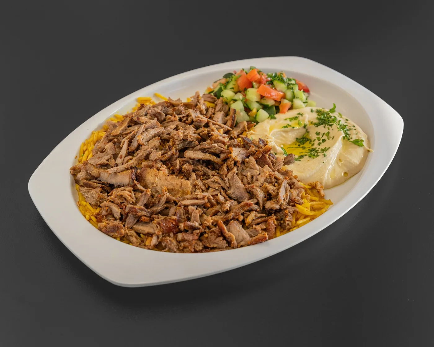Beef shawarma plate with rice, hummus, and Arabic salad