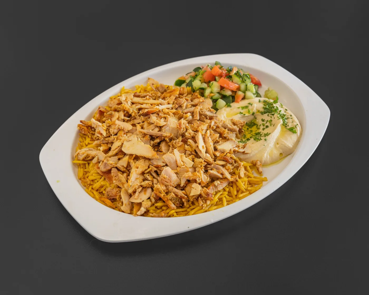 Chicken shawarma plate with rice, hummus, and salad