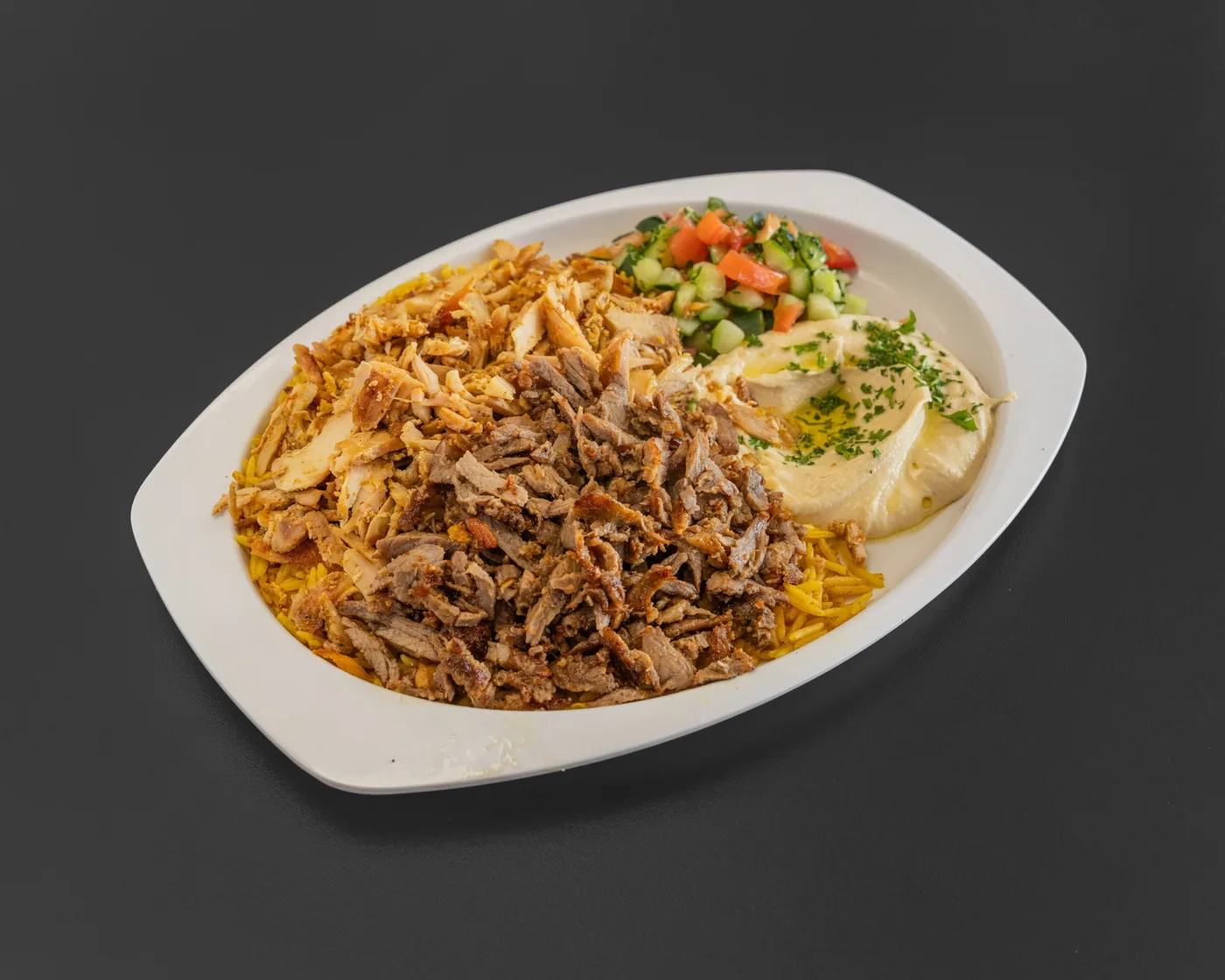 Mixed shawarma plate with hummus and Arabic salad