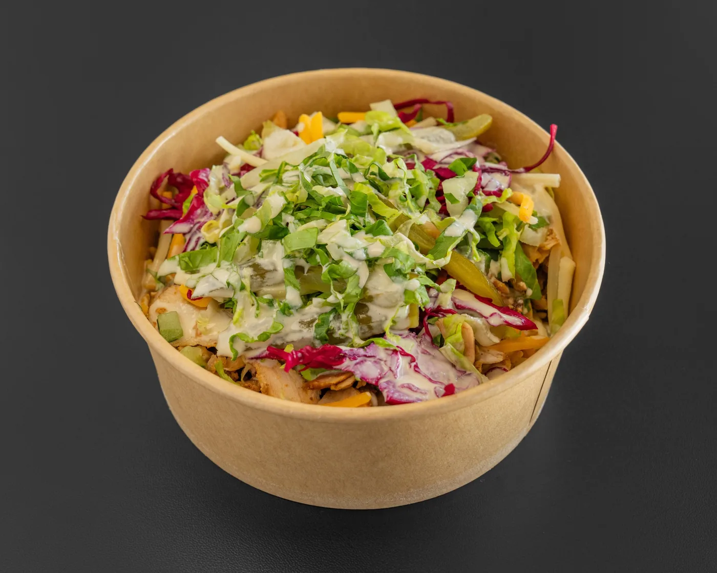 Loaded shawarma bowl with vegetables and sauce